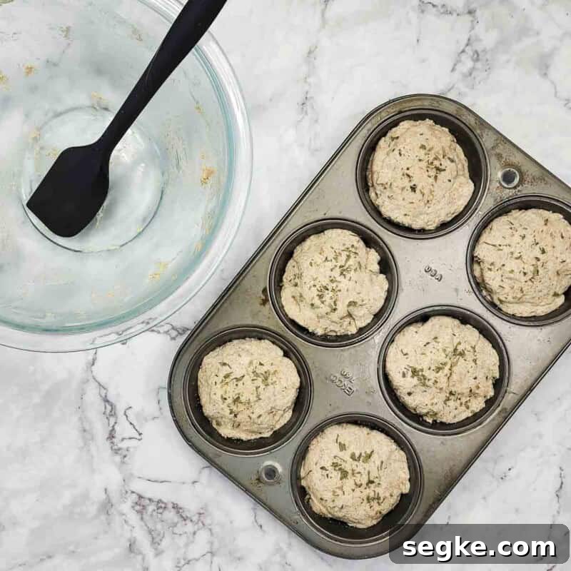 Flaky Mozzarella-Stuffed Whole-Wheat Biscuits Recipe 8 Overhead view of process shot 5 - spray the tops lightly with cooking spray, and sprinkle with garlic salt and parsley flakes, if desired.