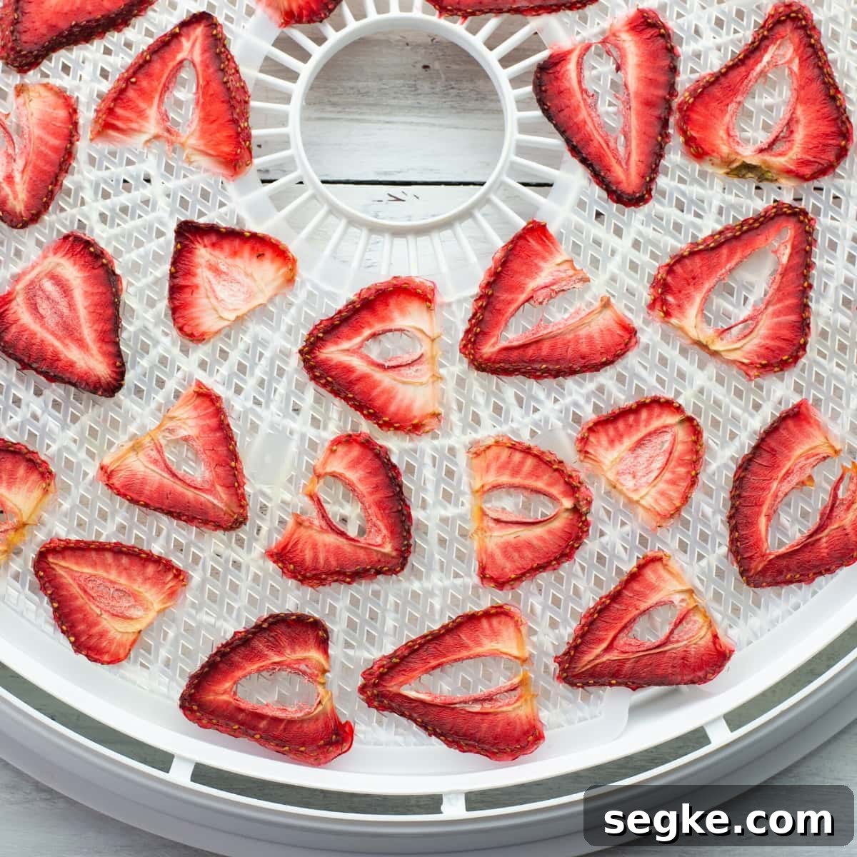 How to Can Strawberries: Recipes and Canning Tips 4 Overhead photo of dehydrated strawberries that have been sliced
