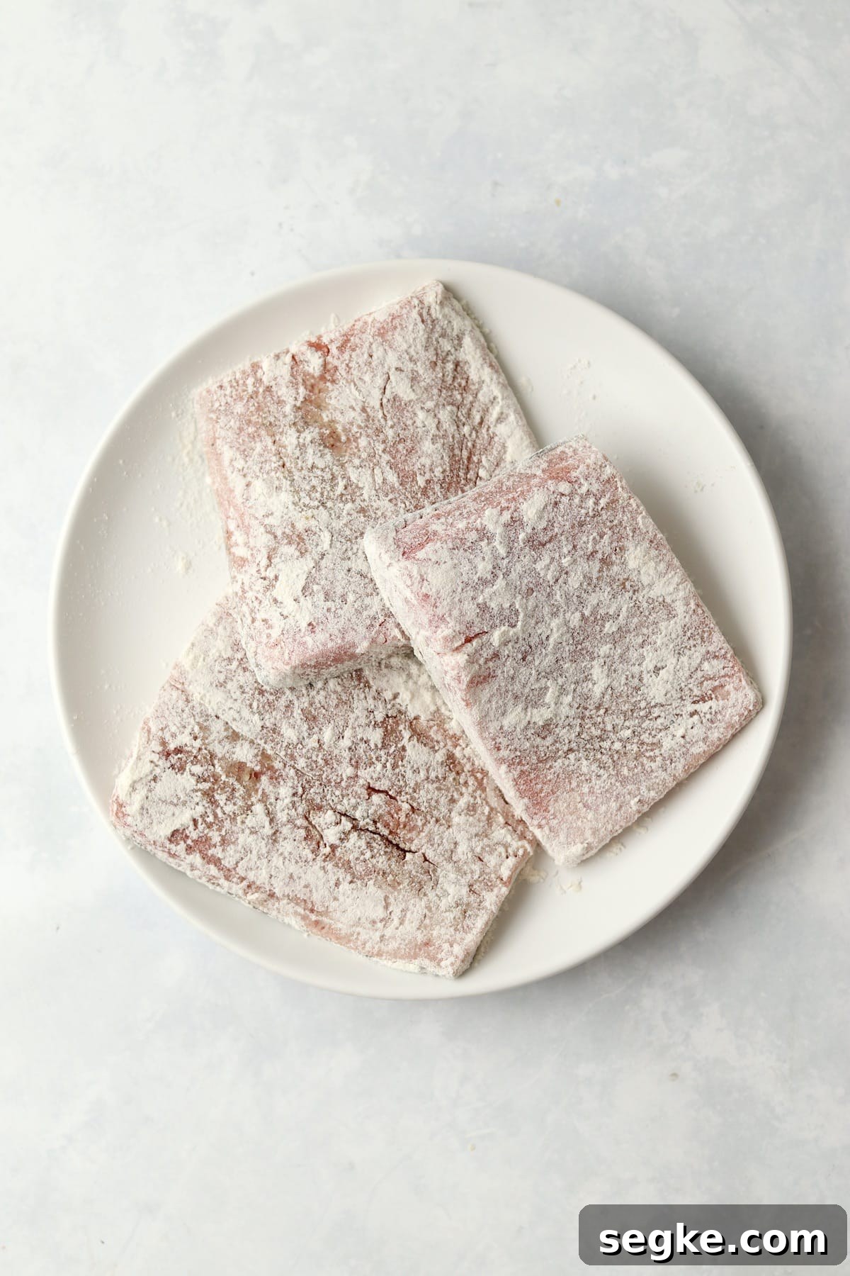 salmon filets dredged in flour.