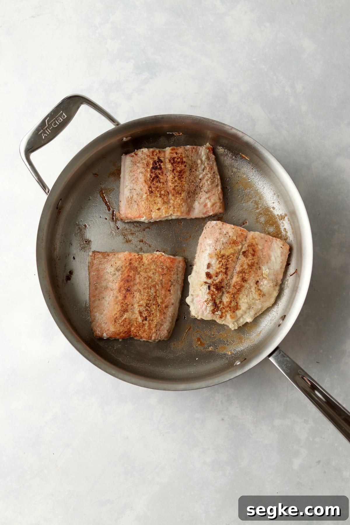 salmon cooked in pan.