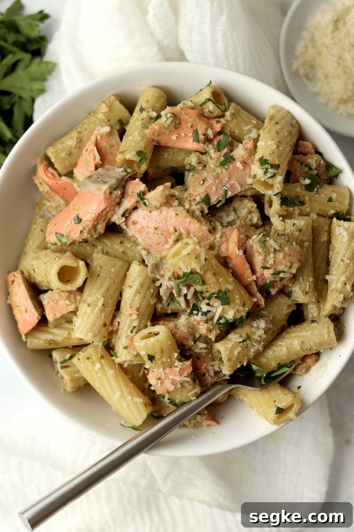 salmon pesto pasta with parsley and parmesan