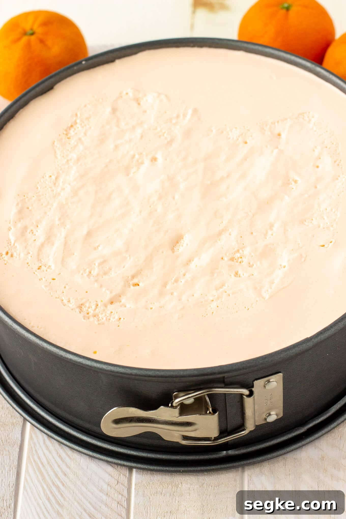 Creamy orange pie in a cheesecake pan.