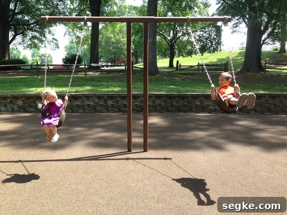 Judah swinging with his cousin Avery