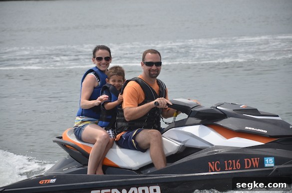 Uncle Clayton and Auntie Heather with Judah on a jet ski