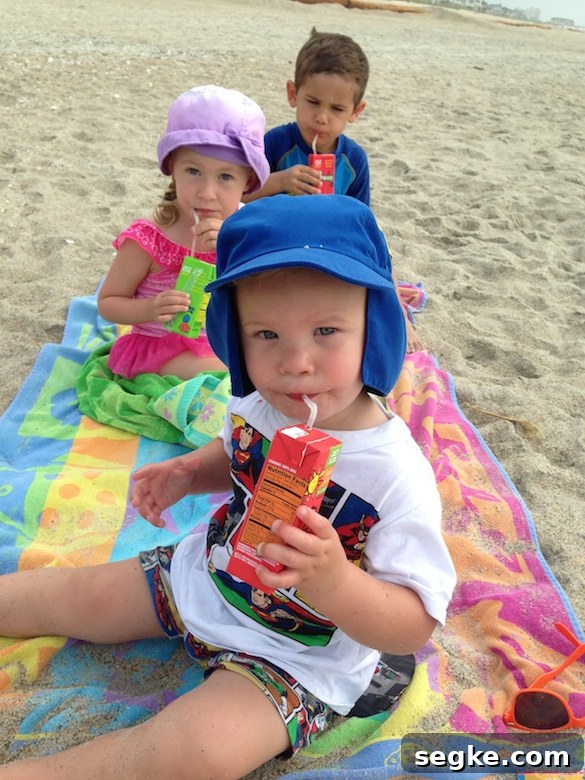 Cousins having a drink break at the beach