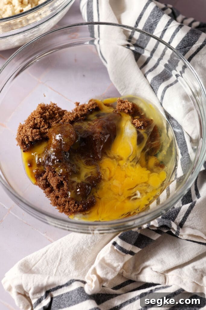 eggs and brown sugar in a bowl before mixing