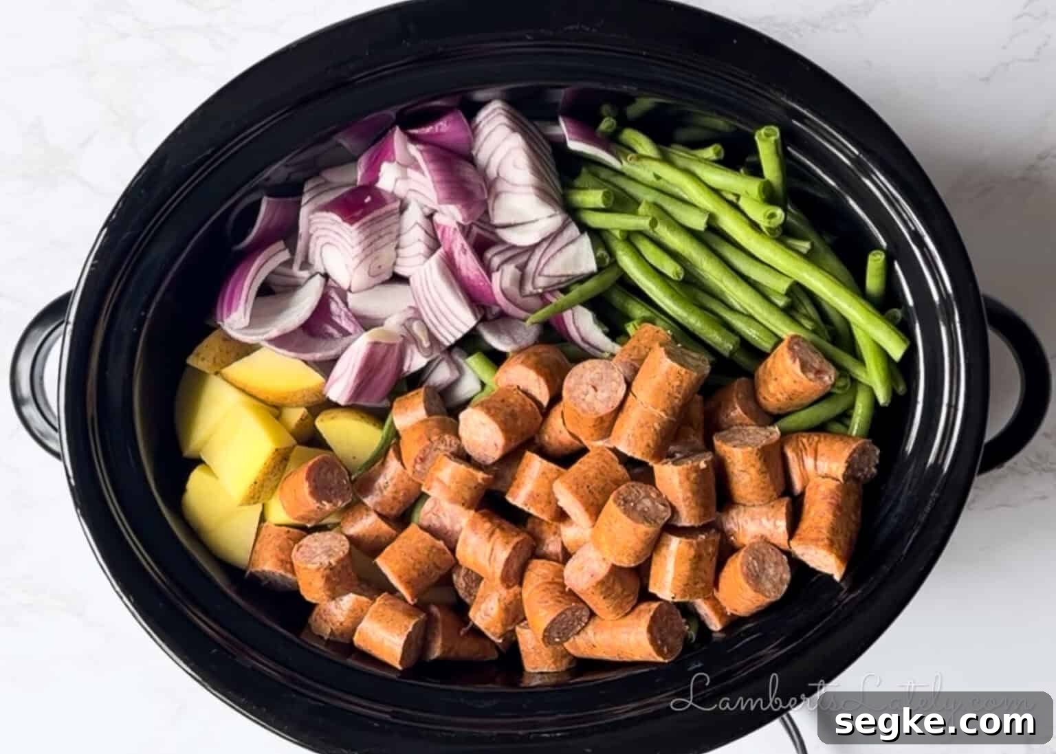 Slow Cooker Southern Swamp Potatoes Recipe 7 added sausage to the vegetables in the crock pot.