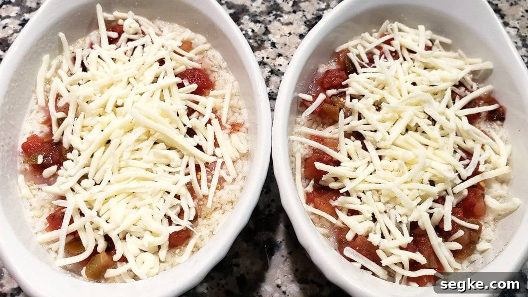 chicken and rice in two casserole dishes, ready to bake