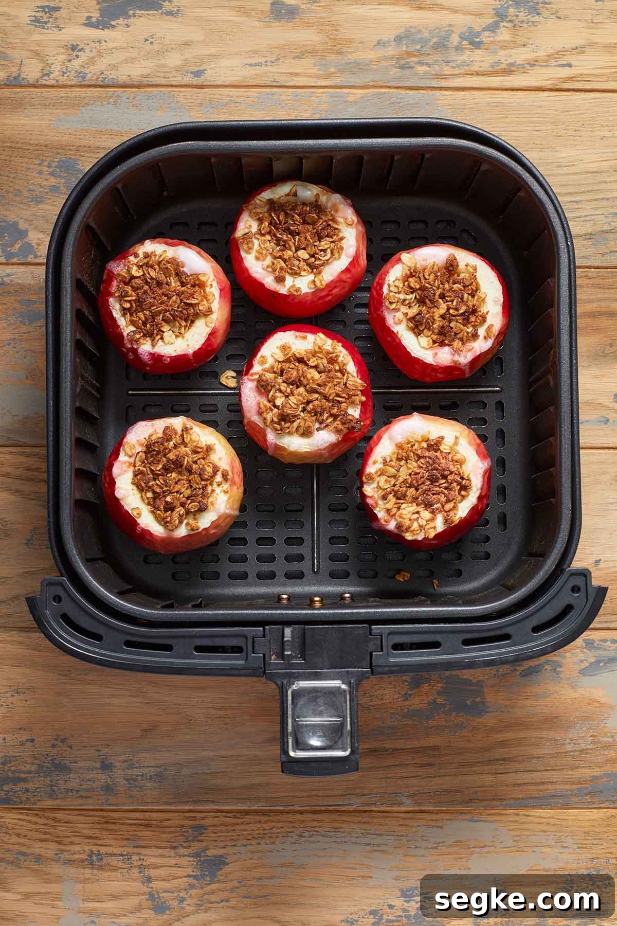 Baked apples in the air fryer basket.