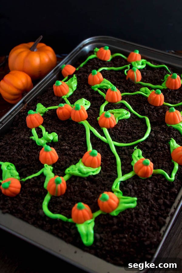 This Pumpkin Patch Poke Cake is super fun, easy and festive! This cute dessert would be a great treat to serve after Thanksgiving dinner!