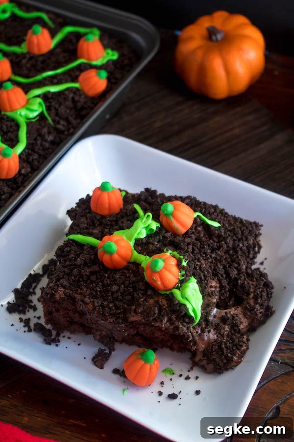 Pumpkin Patch Poke Cake slice on plate