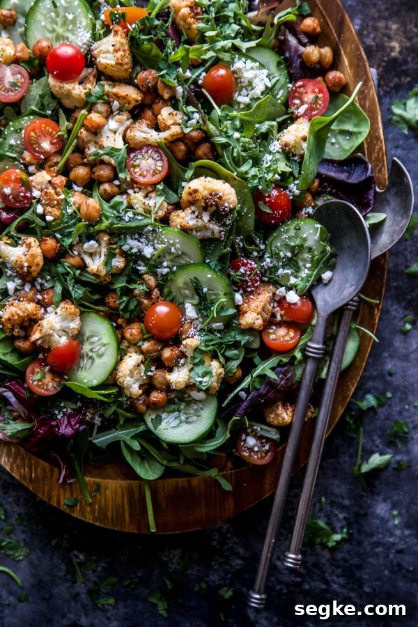 Smoky Roasted Cauliflower and Chickpea Salad 4 Smoky cauliflower chickpea salad plated with greens