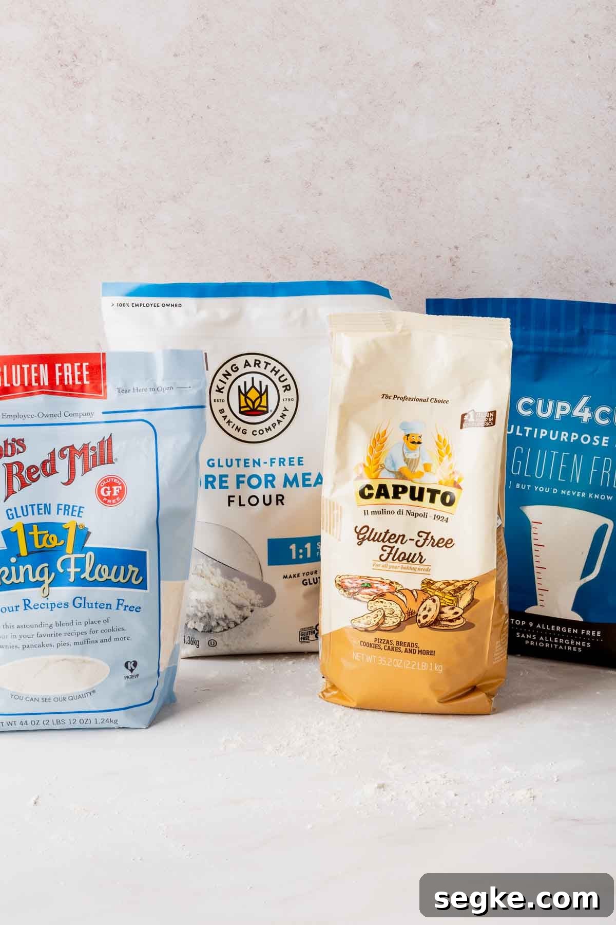 Bags of Bob's Red Mill, King Arthur, Caputo Fioreglut, and Cup4Cup gluten-free flour blends.