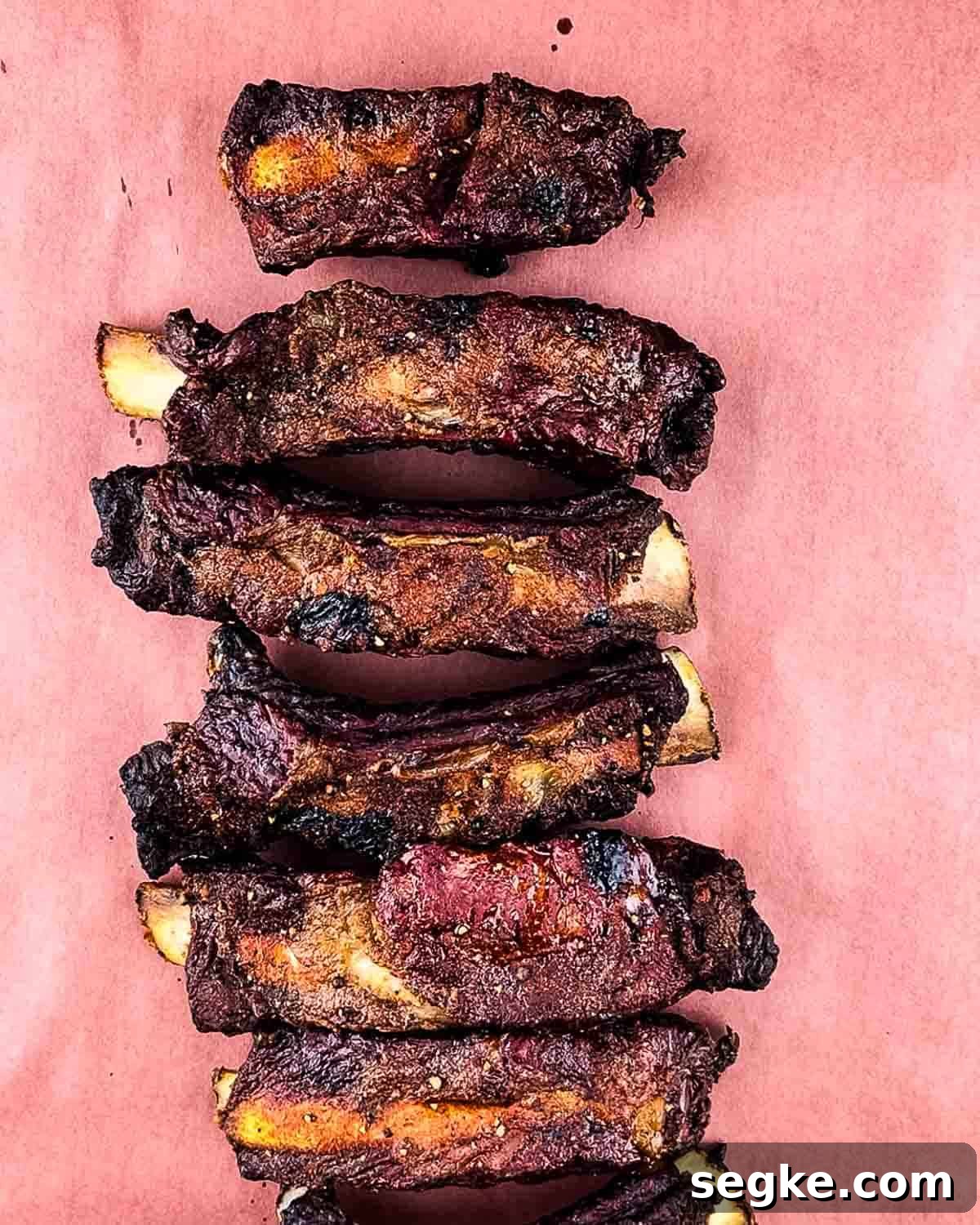 How to Smoke Beef Back Ribs on a Pellet Grill 10 The ribs placed on pink butcher paper after smoking for 3 hours.