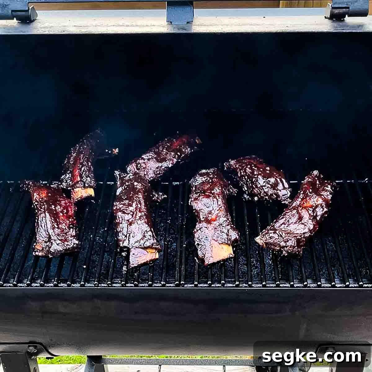 How to Smoke Beef Back Ribs on a Pellet Grill 14 The sauced ribs on the grill grates of the pellet smoker.