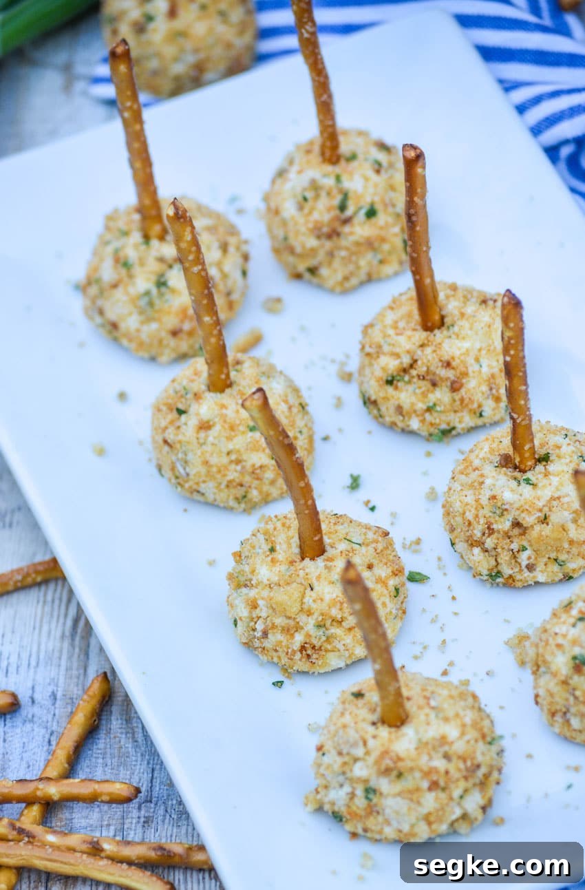 mini goat cheese balls on a white serving platter