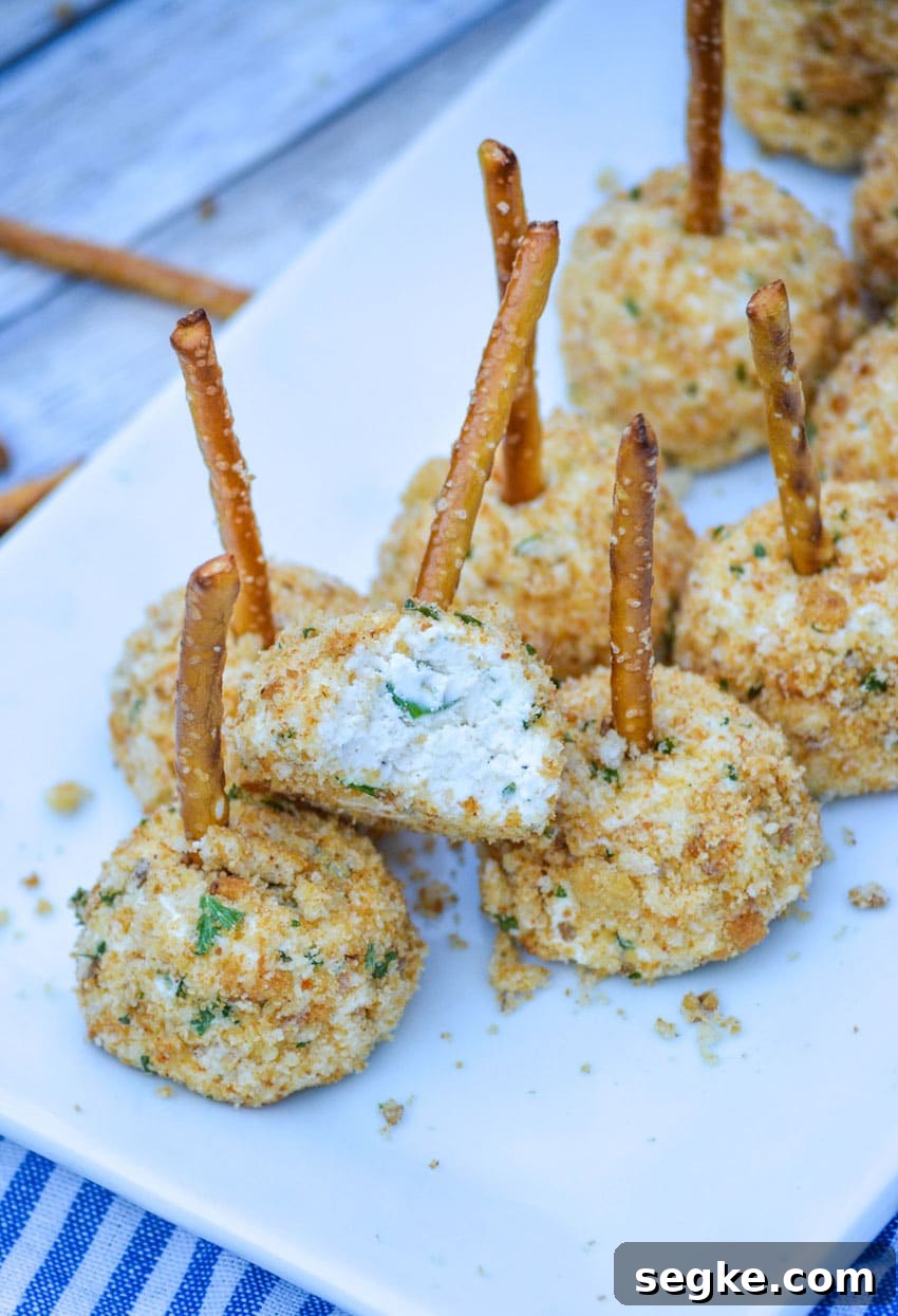 mini goat cheese balls on a white serving platter
