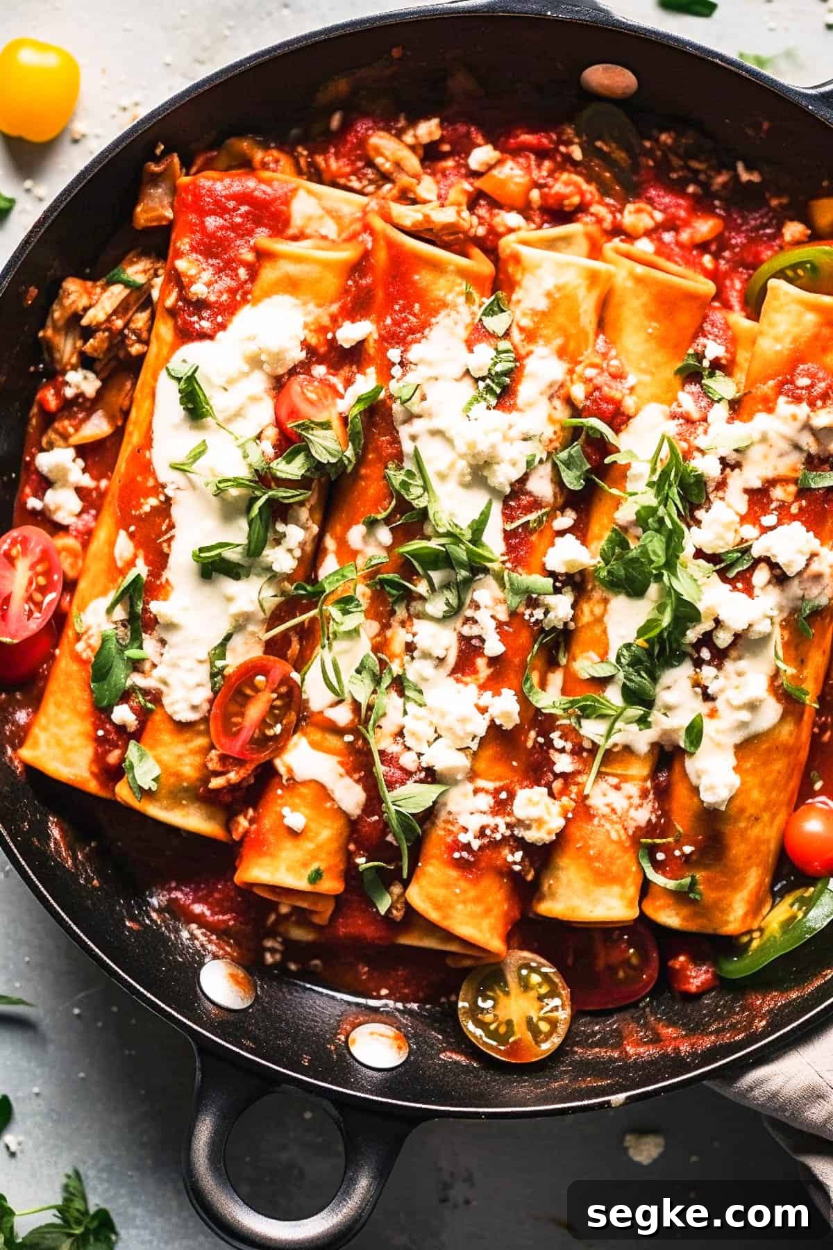 Easy vegetarian enchilada recipes with cheese in a skillet.