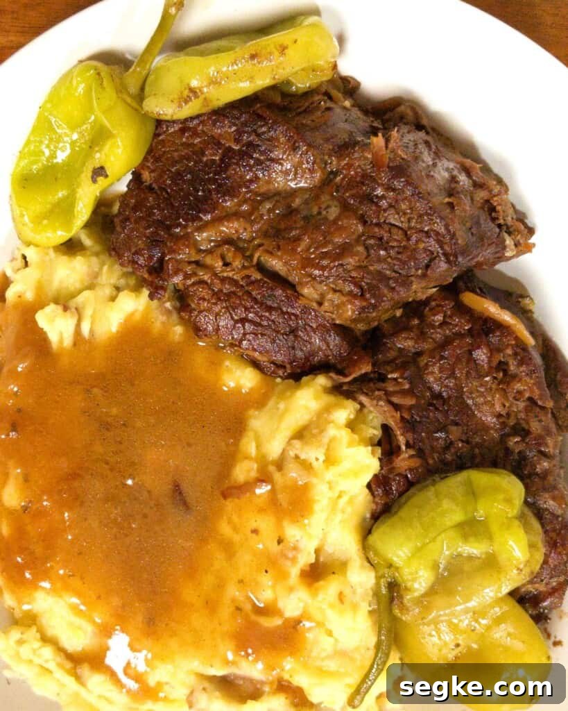 Instant Pot Mississippi Pot Roast Recipe (Juicy & Tender) 2 Mississippi pot roast with pepperonis mashed potatoes and gravy.