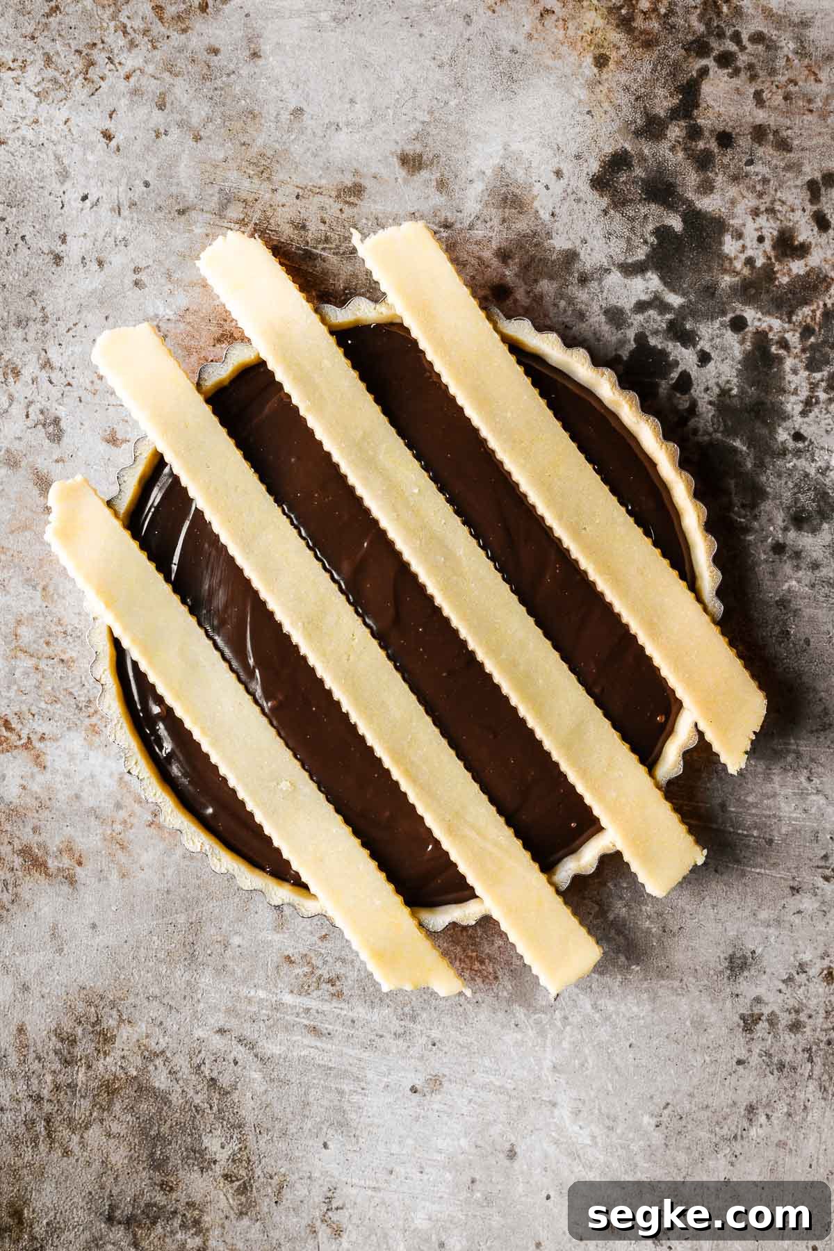 Nutella Crostata: Italian Hazelnut Chocolate Tart Recipe 16 Strips of lattice dough on an unbaked chocolate filled tart