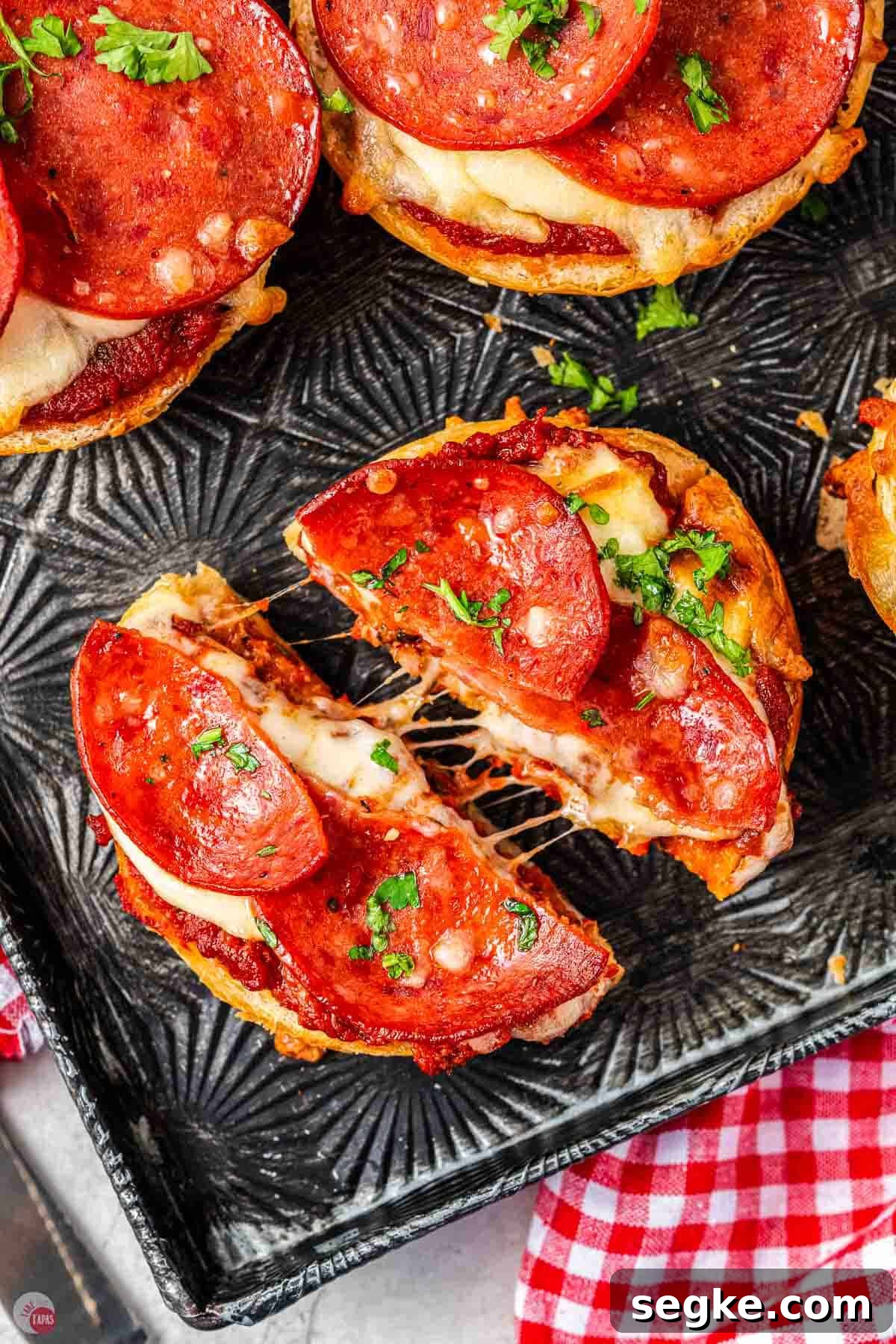 Crispy Air Fryer Pizza Bagels Recipe 11 pepperoni pizza bagel cut in half with melted cheese