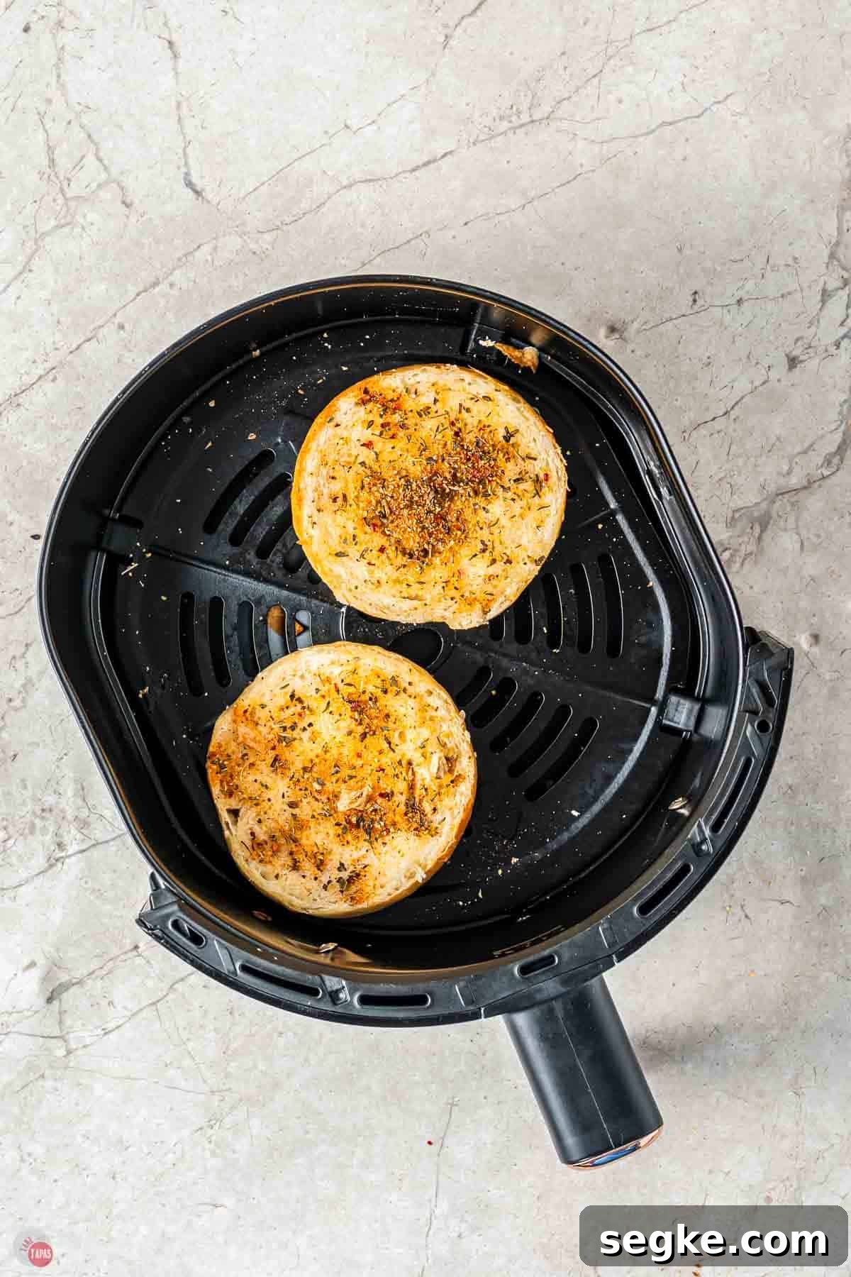 Crispy Air Fryer Pizza Bagels Recipe 5 toasted bagel halves in an air fryer basket