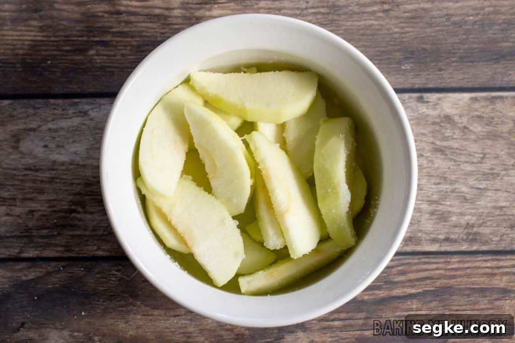 Individual Apple Crumble Recipe for One 4 apples and sugar in baking dish
