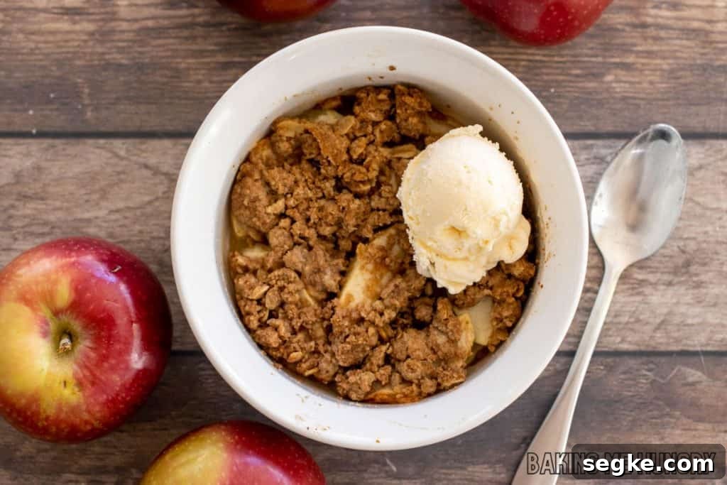 Individual Apple Crumble Recipe for One 8 single serve apple crisp topped with vanilla ice cream from overhead