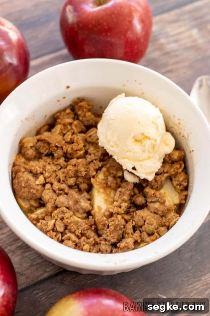 Individual Apple Crumble Recipe for One 9 single serve apple crisp in small baking dish with fresh apples around