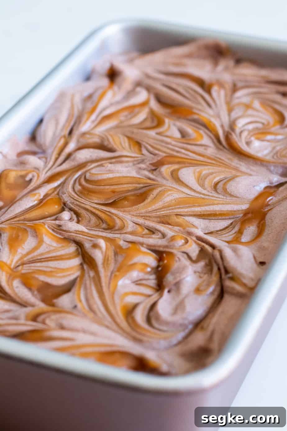 close up of chocolate ice cream with caramel swirls