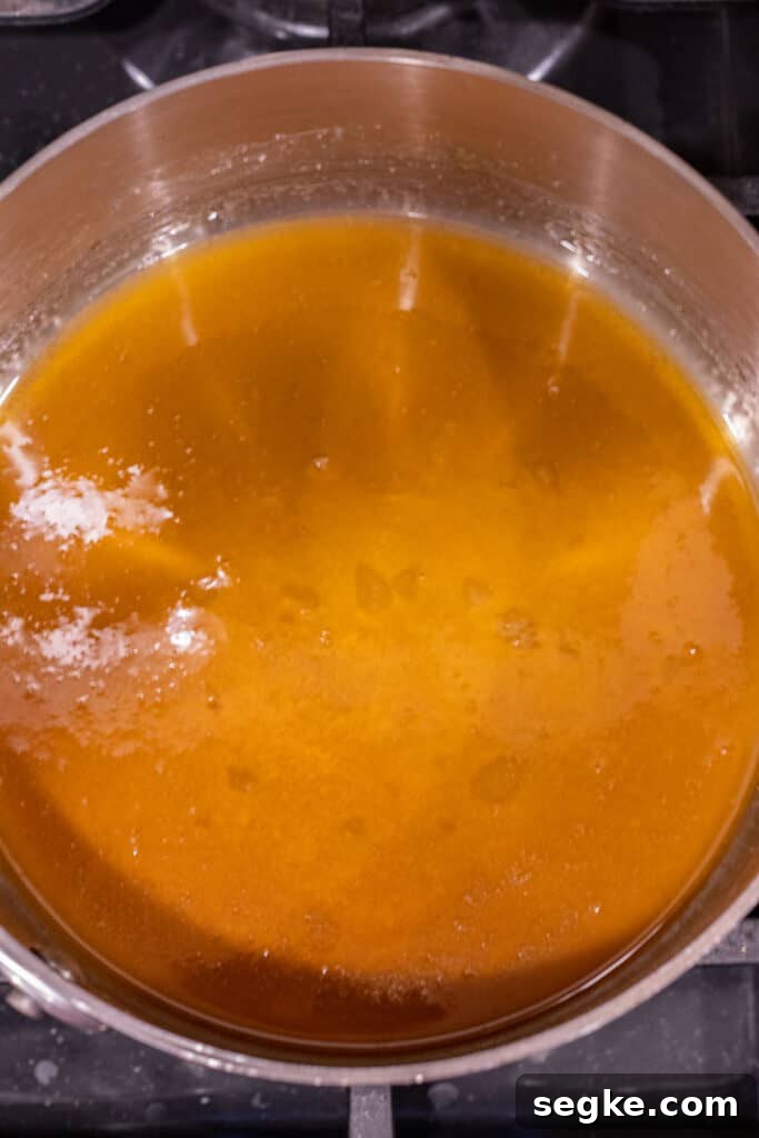 golden brown melted sugar in a saucepan