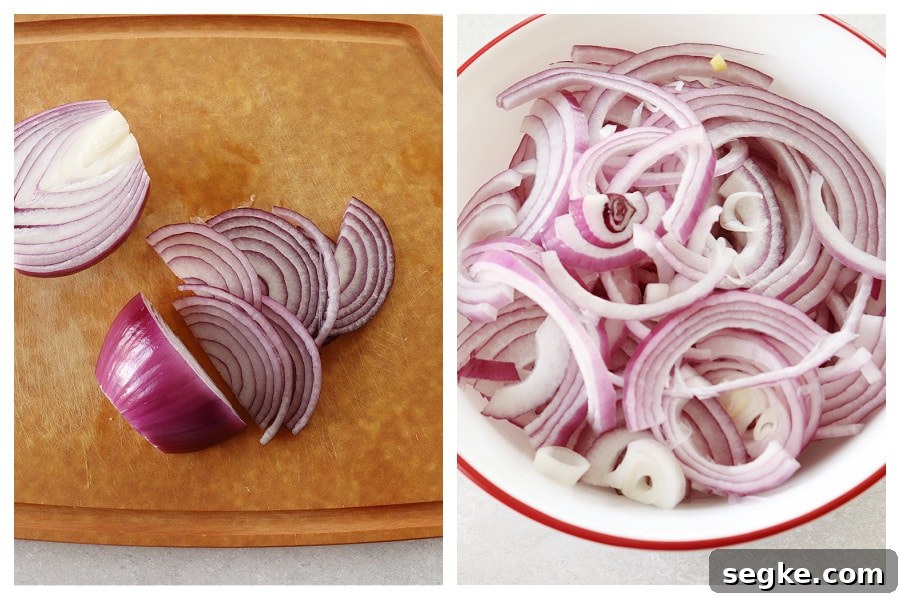 Red onions sliced on a cutting board and in a bowl.