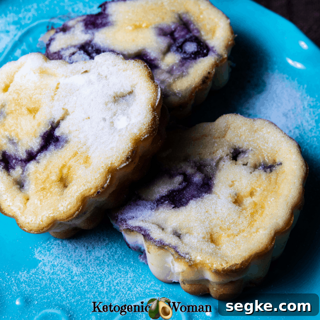 cream cheese muffins with blueberries on blue plate